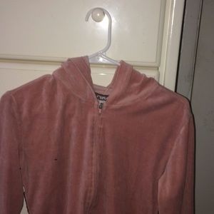 Pink sweater with two stripes on each side.